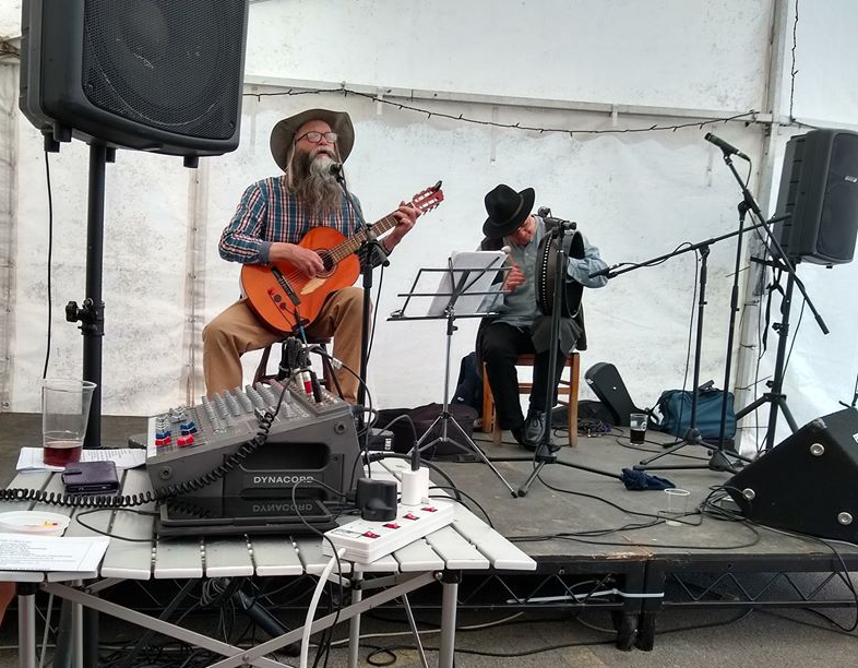 Alan.s.Robinson playing guitar and singing with Paul Pearson on Bodhran